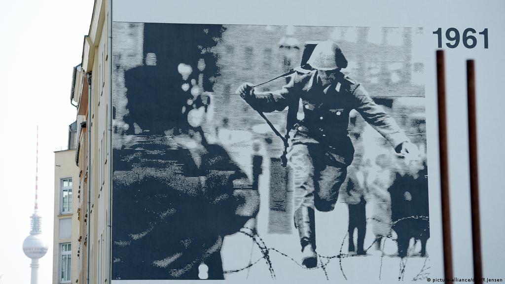 Berlin Wall Graffiti Images Leadping Over Barbwire