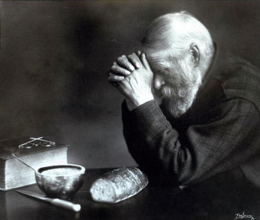 Picture Of Man Praying Over Bread